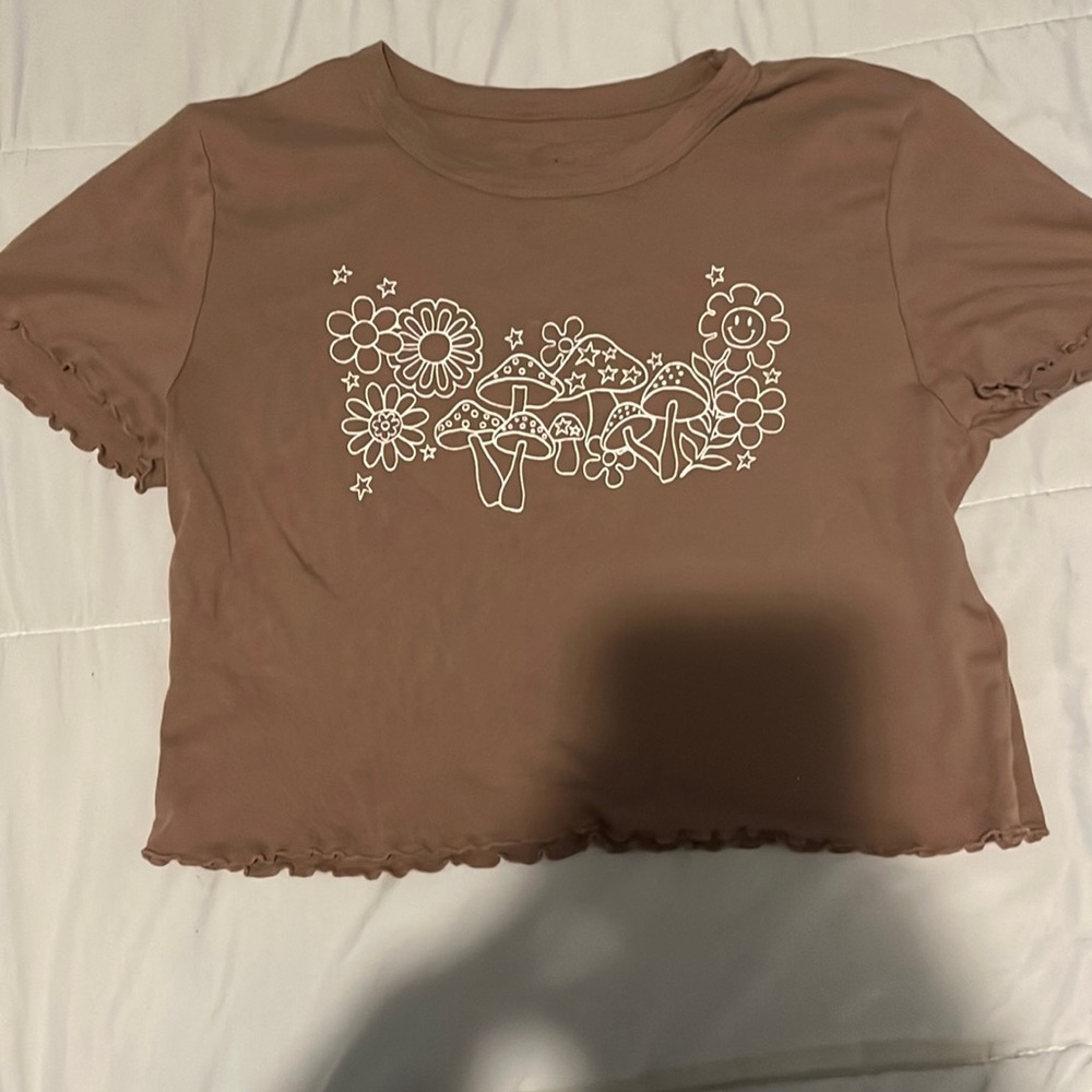 this is a super cute loose fitted white and brown top:) (worn once)